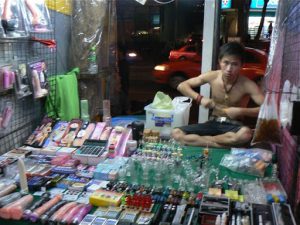 Thailand, Bangkok - night market stall selling adult erotica