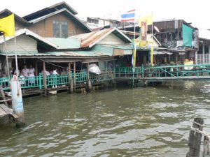 Thailand, Bangkok - riverfront dwellings and restaurants