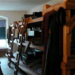 Restored bunk room where prisoners slept in cramped quarters three