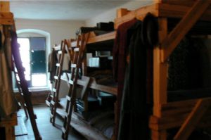 Restored bunk room where prisoners slept in cramped quarters three