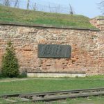 Bronze plaque memorial to the victims of Nazi cruelty, in