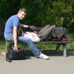 Relaxed gay couple in a park.