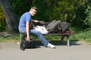 Relaxed gay couple in a park.