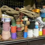 Ropes and cords in a hardware store window.