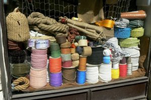 Ropes and cords in a hardware store window.