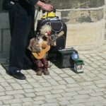 Charles Bridge Puppet playing for change.