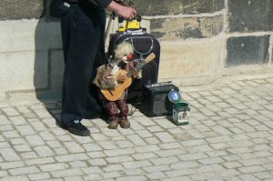 Charles Bridge Puppet playing for change.