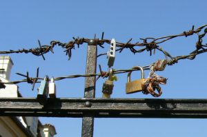 Locks attached to a barbed wire, symbolic of locking out