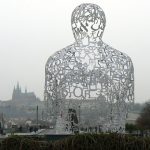 Modern sculpture facing Prague Castle in the distance.