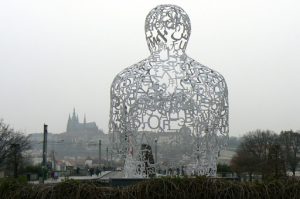 Modern sculpture facing Prague Castle in the distance.