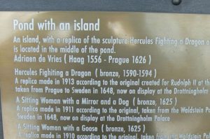 Plaque description of the statue of Hercules fighting a dragon.