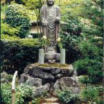 Kyoto: traditional Shinto statue figure holding the customary staff and