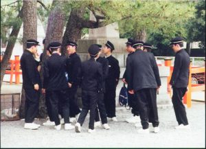 Kyoto: students in their uniforms; thousands of these groups go