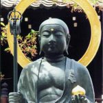 Buddha statue holding symbolic items at Kiyomizudera Buddhist Temple.