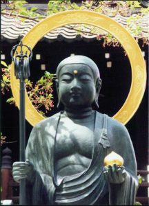 Buddha statue holding symbolic items at Kiyomizudera Buddhist Temple.