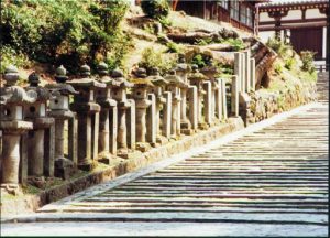 Memorial incense burners along a stone staircase.