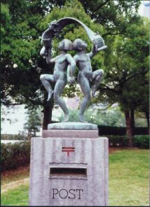 A mailbox adorned with dancing children.