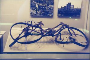 A mangled bicycle, in the Hiroshima Peace Memorial Museum, symbolizes