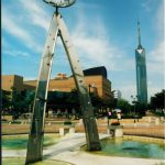 Sculpture near the library with Fukuoka Tower in the background.