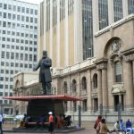 Statue of a politician in front of public library.