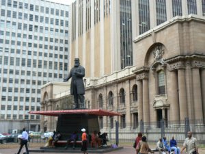 Statue of a politician in front of public library.