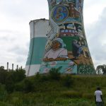 Decorated unused power plant cooling tower.