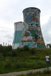 Decorated unused power plant cooling tower.