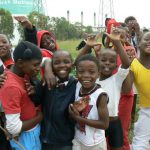 Playful school kids in Soweto posing for a photo op.