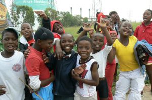 Playful school kids in Soweto posing for a photo op.