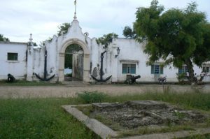 Unrestored old colonial naval building.