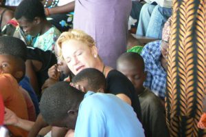 Church service at Arcos-Iris Ministries orphanage; the white woman is