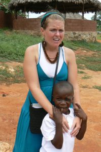 Staff member with a child; many children seek physical contact