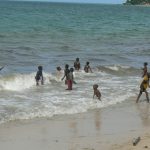 Local children enjoying the surf.