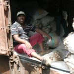 Crew member riding in the freight car.