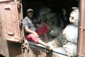 Crew member riding in the freight car.