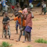 Young boys at a market with their hoes.