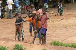 Young boys at a market with their hoes.