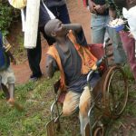 A disabled man with no hands begging for handouts.