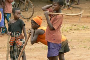 Young boys at a market with their hoes.