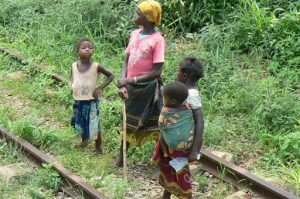 Children along the tracks; the girls learn at an early
