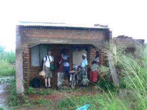 Waiting out a rain downpour halfway from Mandimba to Malawi.