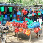 Colorful red plastic merchandise in Mangochi, market.