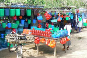 Colorful red plastic merchandise in Mangochi, market.