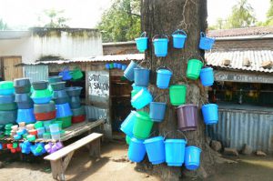 Colorful blue plastic merchandise in Mangochi, market.