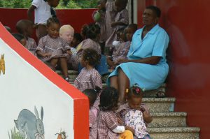 Teacher with students at school.