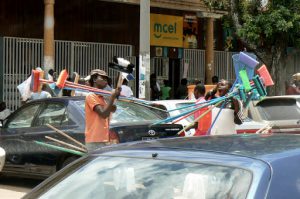 Broom sellers in the street.