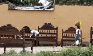 Bed maker in the marketplace.