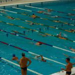 Swimmers warming up before their races.