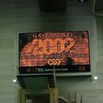 Scoreboard in the pool with Gay Games 2002 logo.