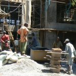 New construction in Lilongwe; each laborer has a separate job: